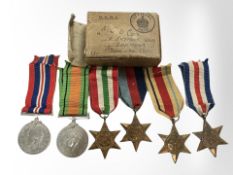 A group of WWII medals in box of issue named to J D Cox,