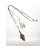 Rose quartz on silver chain, together with amber stone on silver chain.