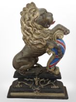 A painted cast-iron lion door stop, height 36cm.