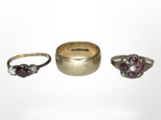 Two 9ct gold gem-set rings and a further band ring.