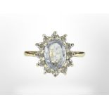An 18ct gold diamond and aquamarine ring, size K CONDITION REPORT: 2.