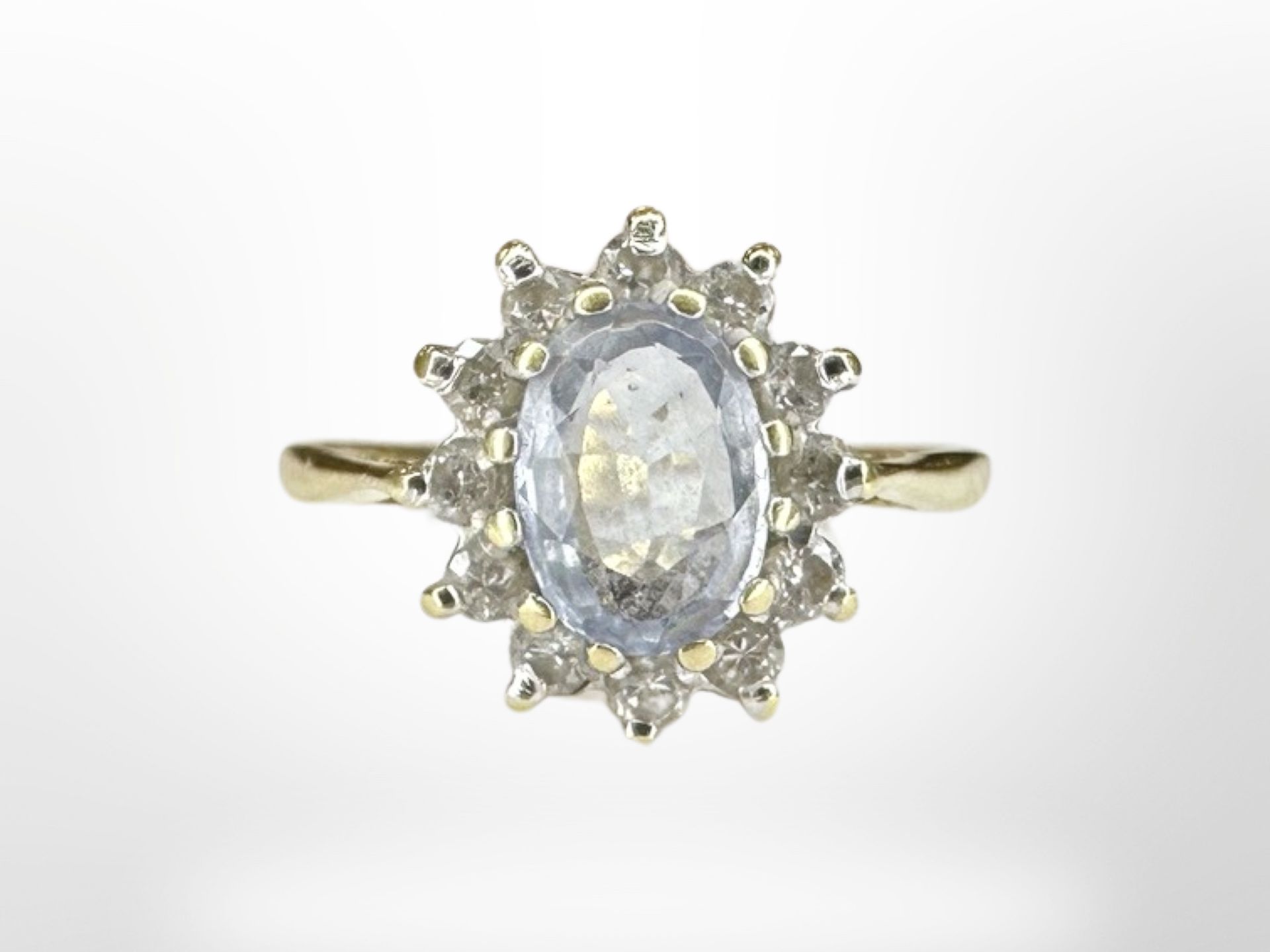 An 18ct gold diamond and aquamarine ring, size K CONDITION REPORT: 2.