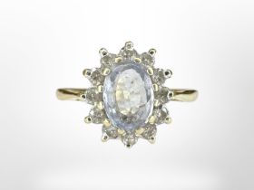 An 18ct gold diamond and aquamarine ring, size K CONDITION REPORT: 2.