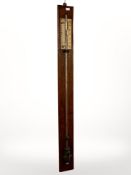 An oak stick barometer by Davis of Leeds, length 106cm.