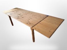 A Scandinavian pine extending dining table,