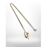 A 9ct yellow gold pendant set with two pearls and two small diamonds,