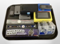 A group of mobile phones, Swatch watch,