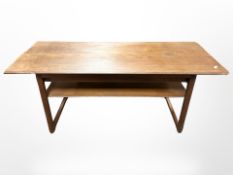 A 1970's Danish rectangular teak two-tier coffee table, 129cm x 51cm x 54cm.