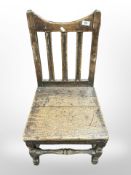 A 19th-century oak kitchen chair.