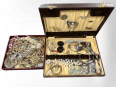 An oak canteen and a shallow tray containing assorted costume jewellery, gilt metal bangles,