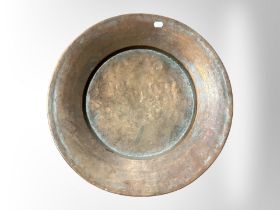 A 19th-century copper shallow bowl, diameter 47cm.