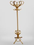 A contemporary bentwood hat and coat stand, height 192cm.