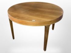 An early 20th-century continental walnut circular dining table, diameter 117cm, height 75cm.