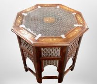 An Eastern hardwood-inlaid octagonal occasional table, diameter 56cm wide x 56cm high.