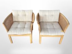 A pair of blond oak framed bergere armchairs,