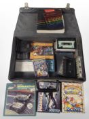 A case containing Sinclair ZX Spectrum cassettes, including Scalextric computer edition, etc.