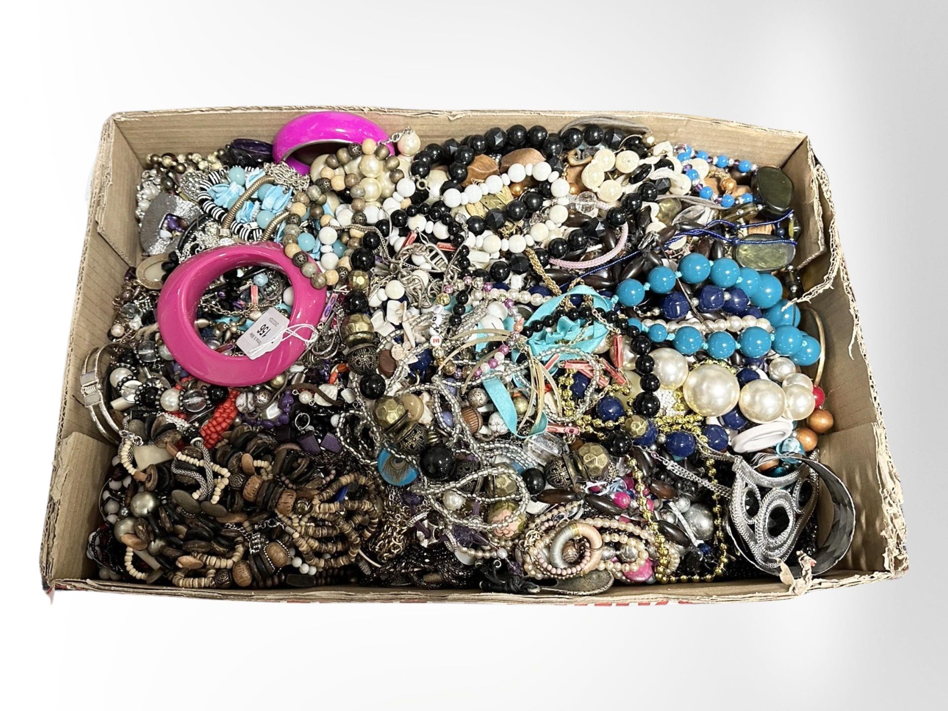 A large box of mixed costume jewellery.