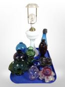 An opaque glass lamp base and other glasswares including vases, bowls.