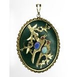 A Chinese jade and gilt metal oval pendant,