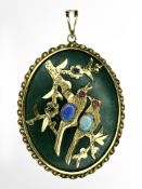 A Chinese jade and gilt metal oval pendant,
