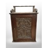 A 19th-century carved oak smoker's cabinet, height 31cm.