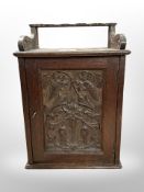 A 19th-century carved oak smoker's cabinet, height 31cm.