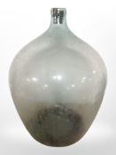 A large glass carboy, height 59cm.