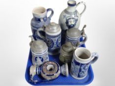 A group of West German earthenware ceramics including pewter-mounted beer steins, wine jugs,