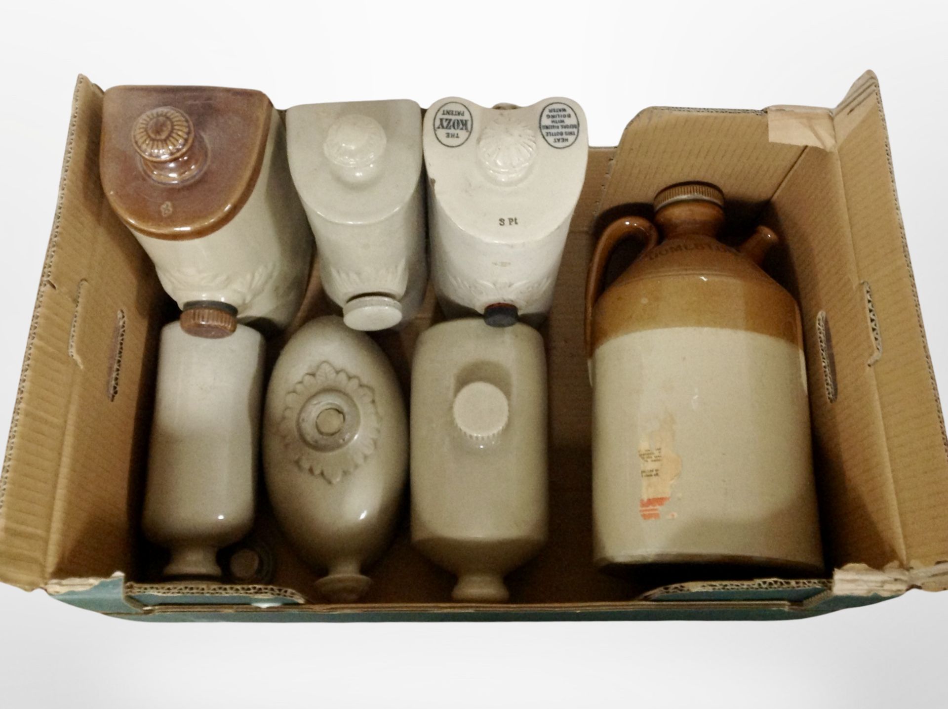 A group of 19th-century pottery hot water bottles, and a further flagon market Domestos.