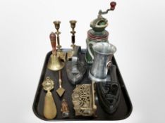 A cast iron and ceramic coffee grinder, a pair of brass candlesticks, shoe horn, two irons,