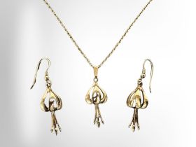 A suite of yellow gold jewellery comprising of pendant on chain and matching pair of earrings,