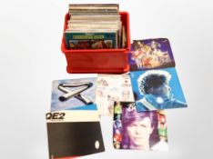 A box of LP records and 45s including Mike Oldfield, The Shadows, Rick Wakeman, Lindisfarne,
