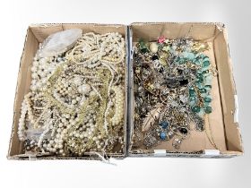 A box of various stone and metal necklaces together with a box of faux and cultured pearls.