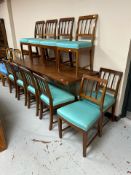 A set of ten early 20th-century Danish mahogany dining chairs upholstered in turquoise fabric.