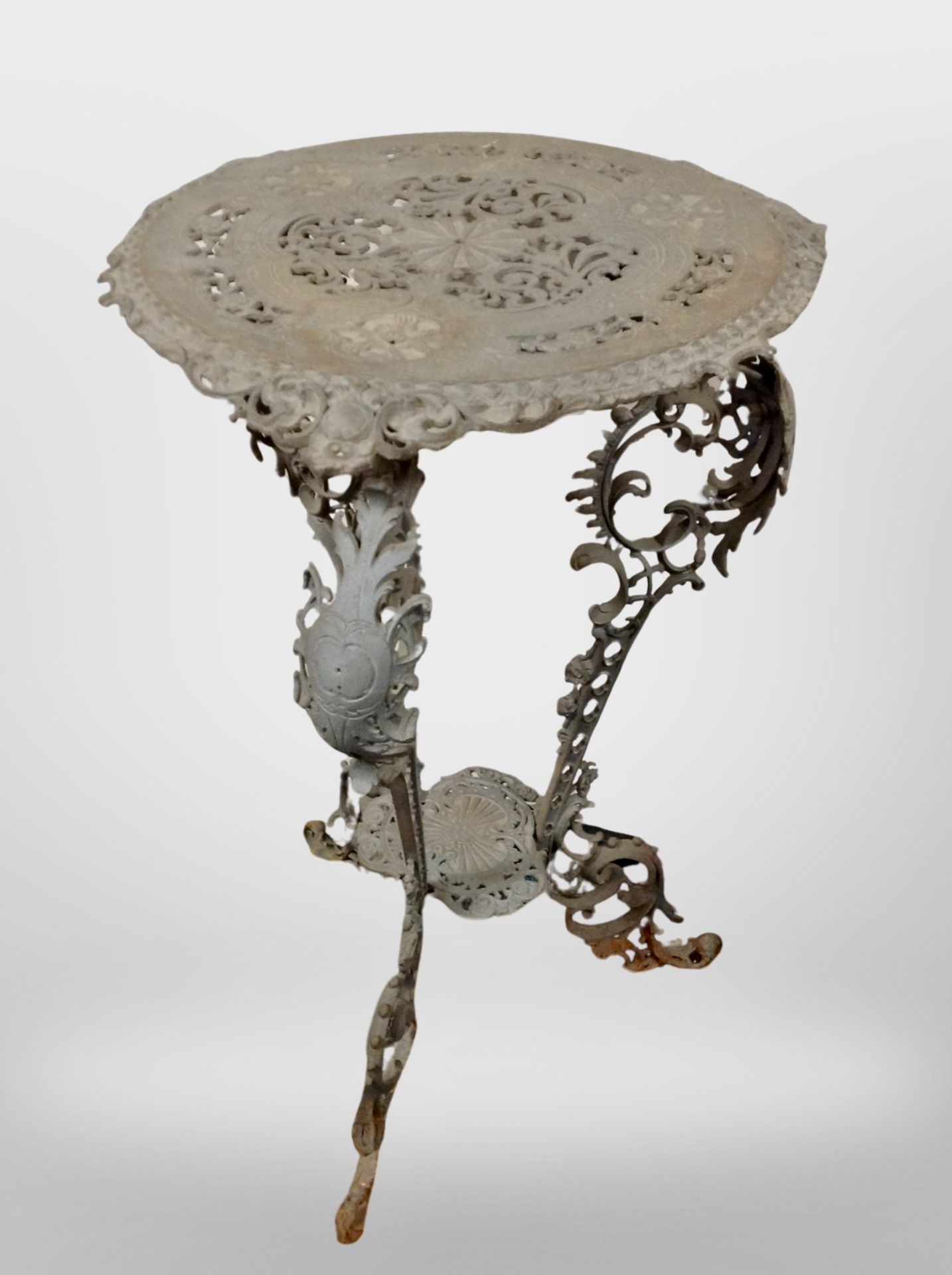 A 19th-century cast-metal jardiniere stand, 77cm high, 47cm diameter.