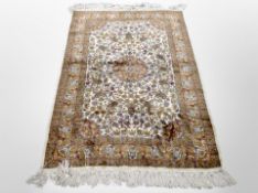 An Isfahan silk rug, Central Iran, 173cm x 102cm.