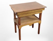 An Edwardian mahogany two-tier occasional table, 64cm x 42cm x 71cm.
