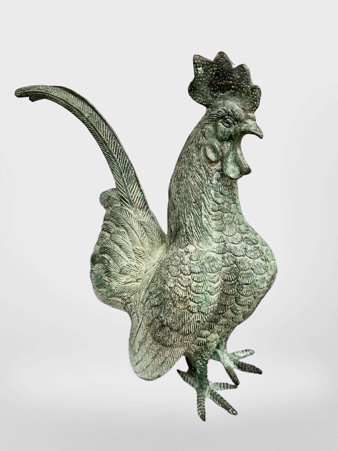 A patinated bronze cockerel figure, height 29 cm.