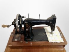 An antique hand sewing machine.