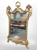 A 20th-century gilt gesso mirror, 73cm x 47cm.