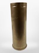 A brass artillery shell, height 33cm.