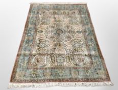 A Kashmir silk rug, 191cm x 124cm.