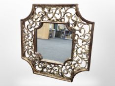 A large contemporary gilt gesso overmantel mirror, diameter 133cm.