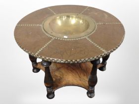 An early 20th-century Danish turned beech and walnut circular low table with brass studded faux