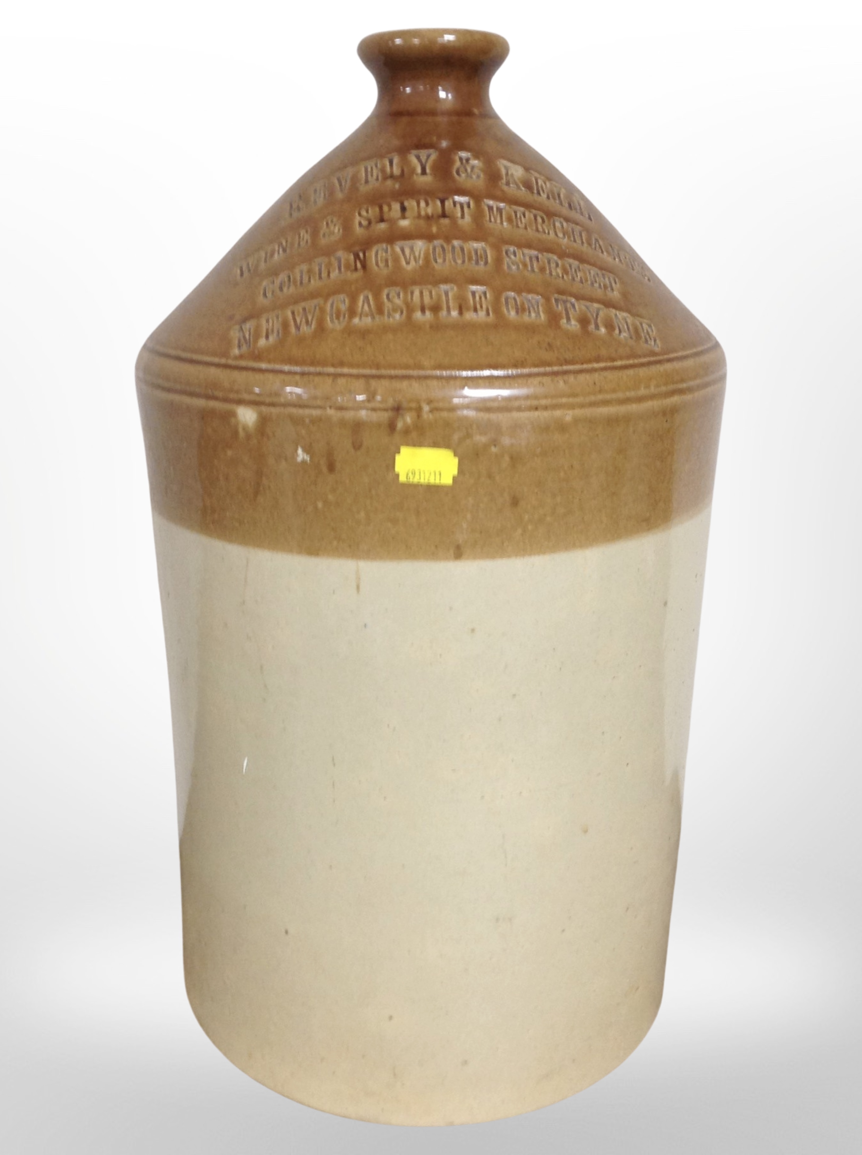 A large Doulton Lambeth stoneware bottle marked 'Revely and Kell Wine and Spirit Merchants,