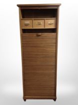 An early 20th-century oak tambour-front office pedestal cabinet, 64cm x 51cm x 169cm.