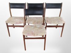 A set of four 20th-century Danish teak dining chairs in black vinyl and fabric upholstery.