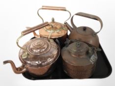 Four copper kettles.