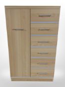 A contemporary laminated bedroom chest, 83cm x 52cm x 140cm,