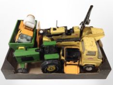A group of vintage Tonka tin plate models including excavator, tractor, etc.